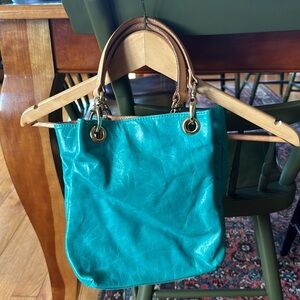 Teal leather hobo bag. Maybe used once. Great condition. Inside is clean.